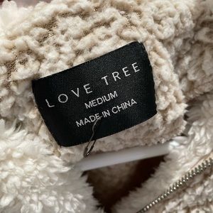 Ivory fleece pullover.